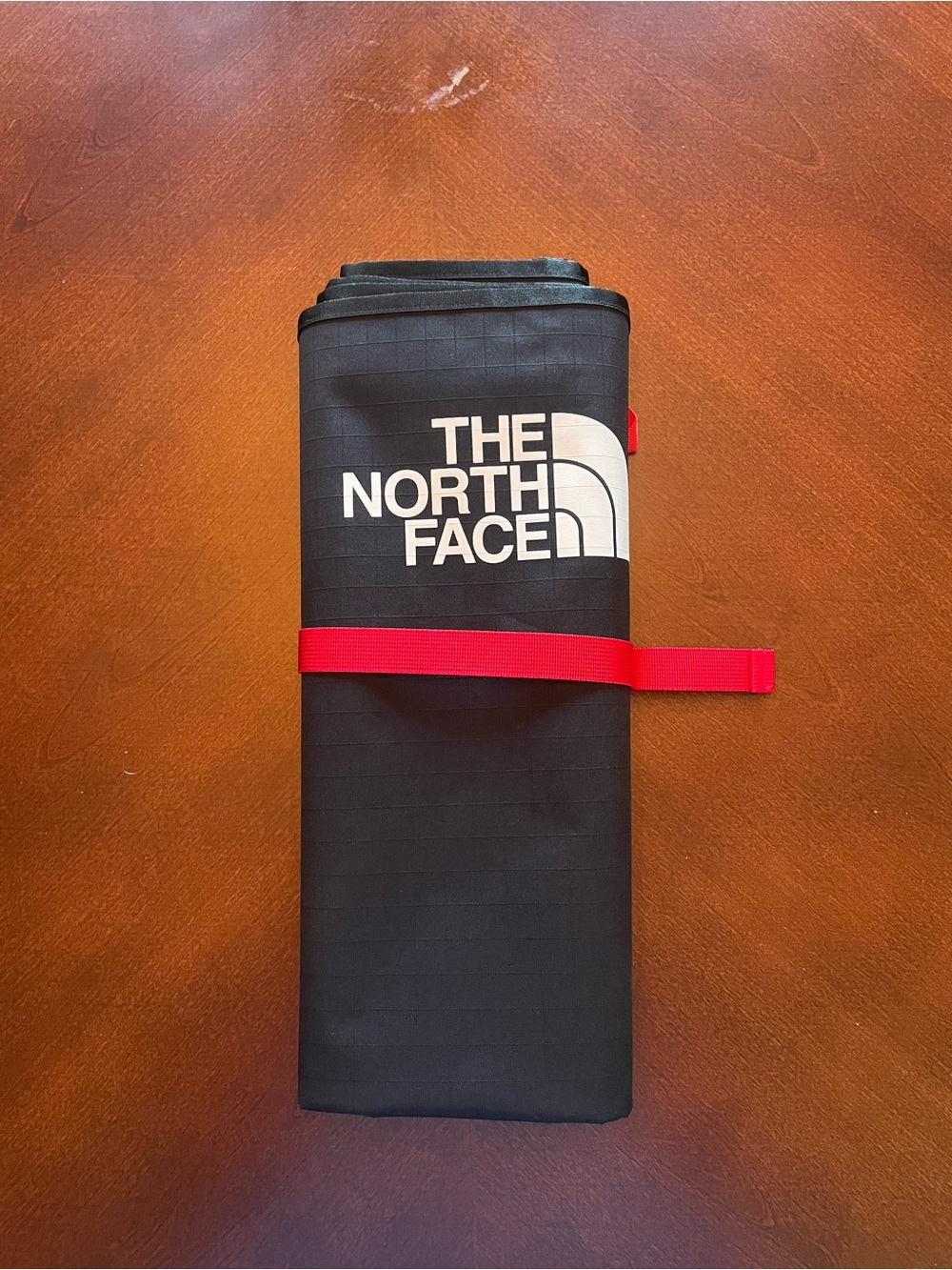 The North Face Black Foldable Travel Tarp with Red Strap